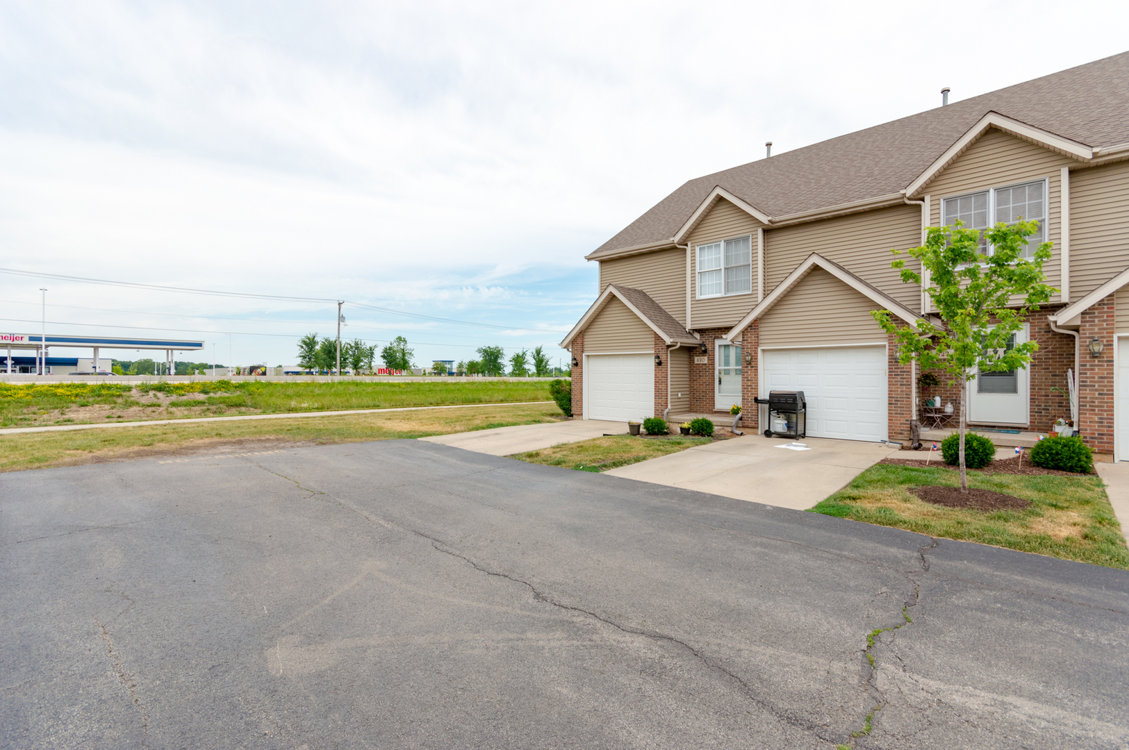 620 South Peace Road, Unit 1 Sycamore, IL 60178 - Photo 14 of 15 a view of a house with a yard and large trees