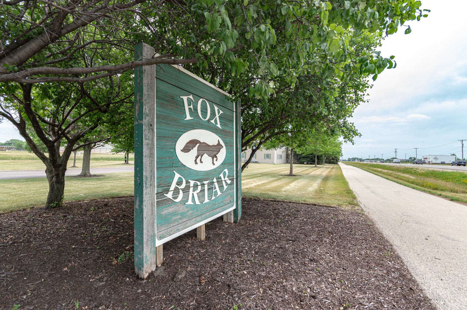 620 South Peace Road, Unit 1 Sycamore, IL 60178 - Photo 4 of 15 a view of a street with sign board