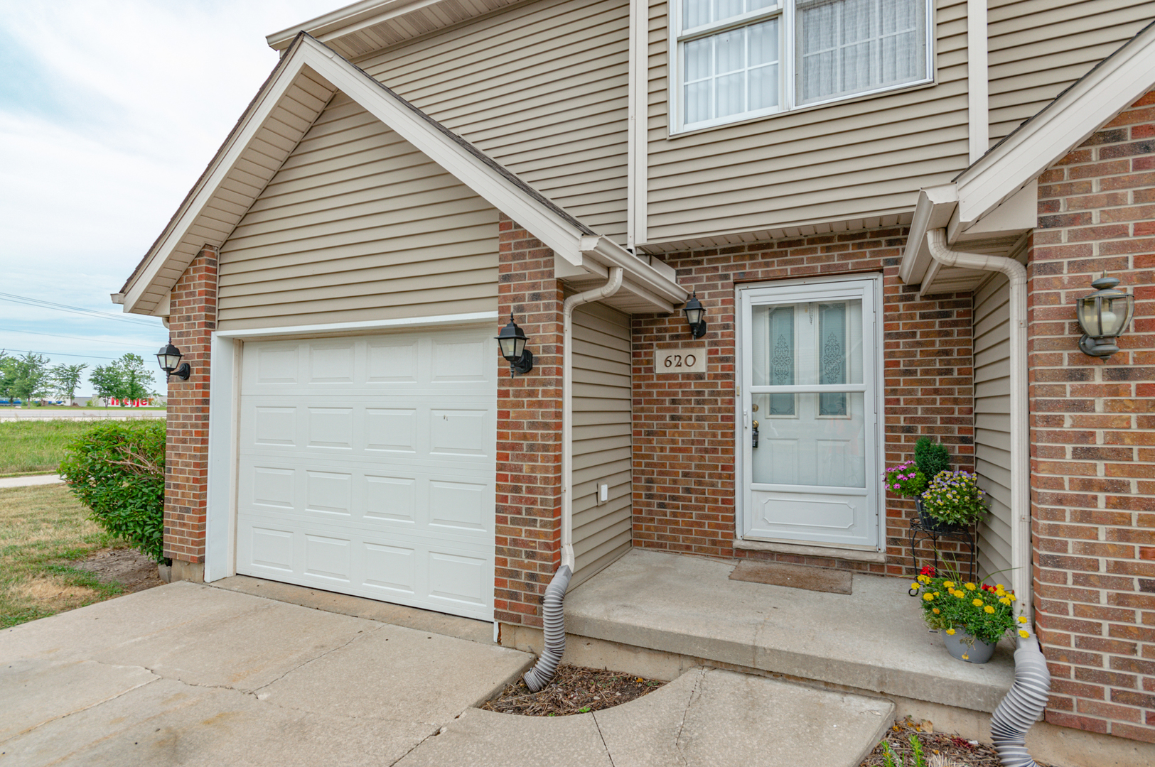 620 South Peace Road, Unit 1 Sycamore, IL 60178 - Photo 5 of 15 a small white building with a white roof and a yard