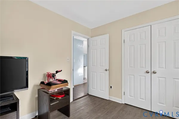 a room with furniture and a flat screen tv
