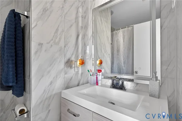 a bathroom with a sink and a mirror