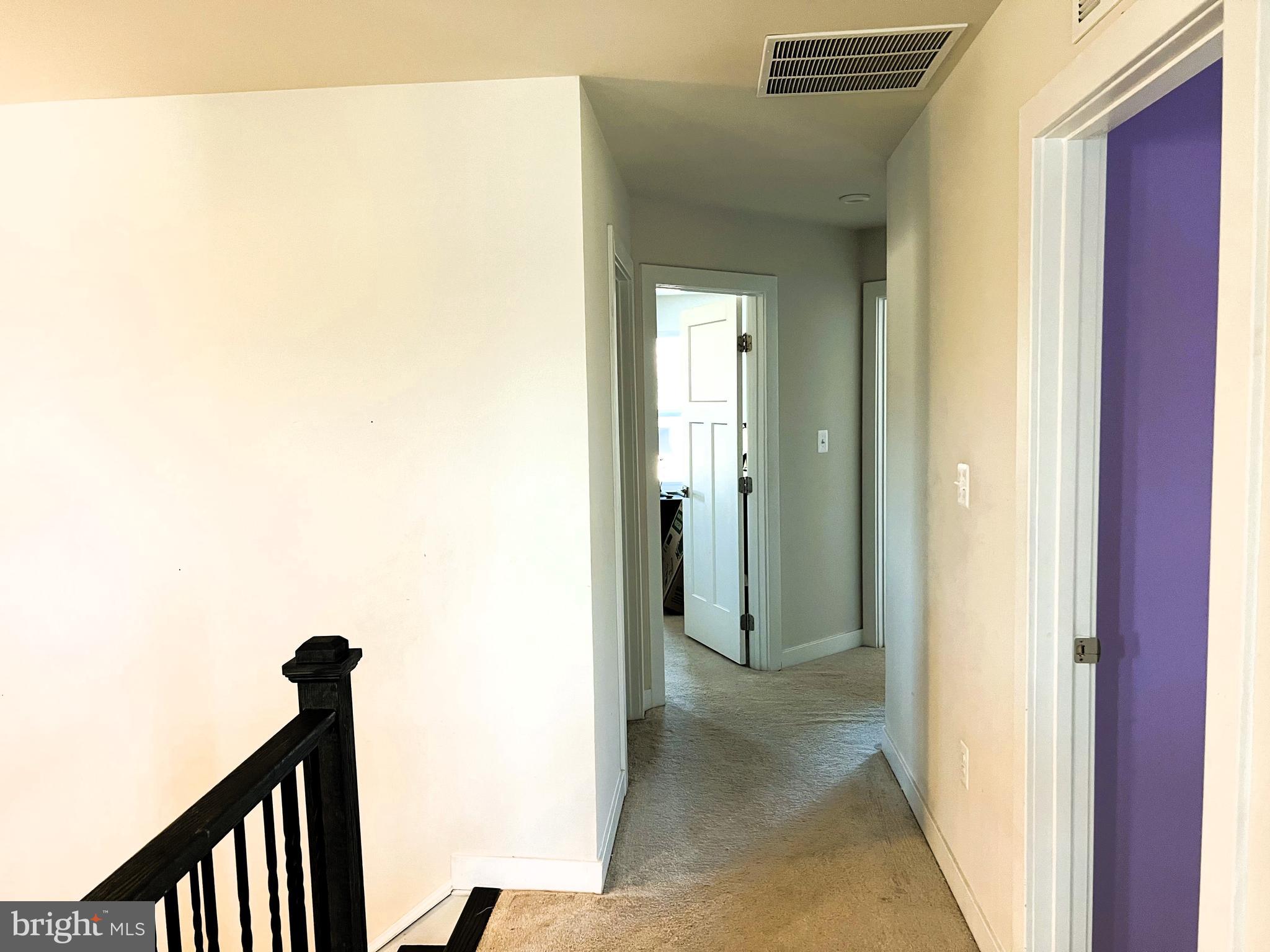 14905 Mapleridge Road Culpeper, VA 22701 - Photo 17 of 40 a view of a hallway with wooden floor and staircase