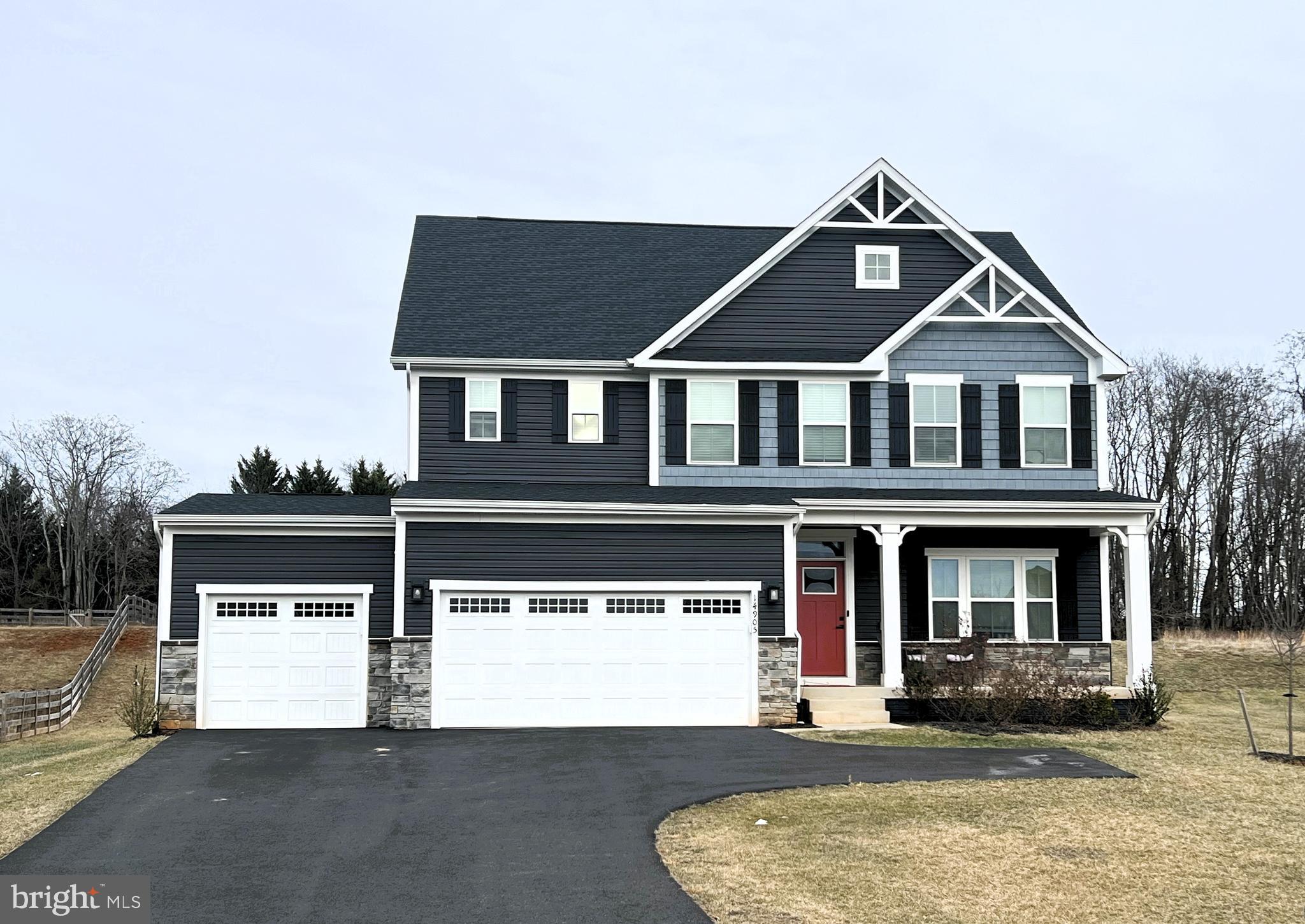 14905 Mapleridge Road Culpeper, VA 22701 - Photo 2 of 40 a front view of a house with a yard and garage