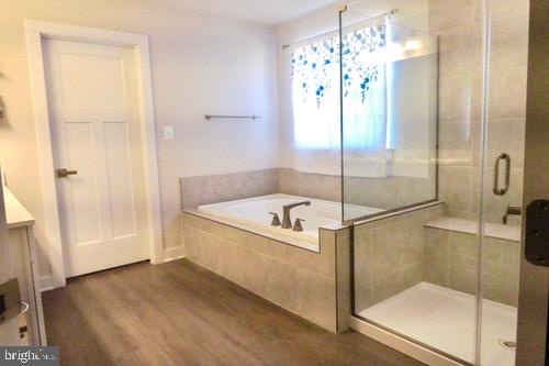 14905 Mapleridge Road Culpeper, VA 22701 - Photo 23 of 40 a bathroom with a tub and shower