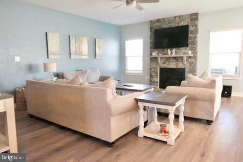 14905 Mapleridge Road Culpeper, VA 22701 - Photo 29 of 40 a living room with furniture a flat screen tv and a fireplace