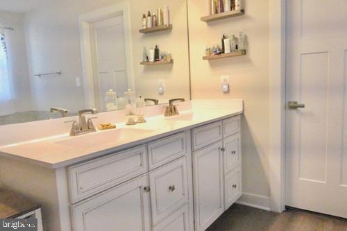 14905 Mapleridge Road Culpeper, VA 22701 - Photo 32 of 40 a bathroom with a sink and a mirror
