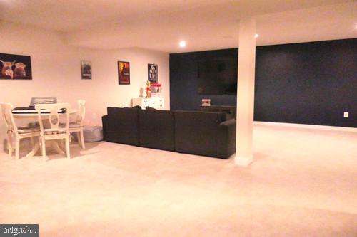 14905 Mapleridge Road Culpeper, VA 22701 - Photo 35 of 40 a living room with furniture and a flat screen tv