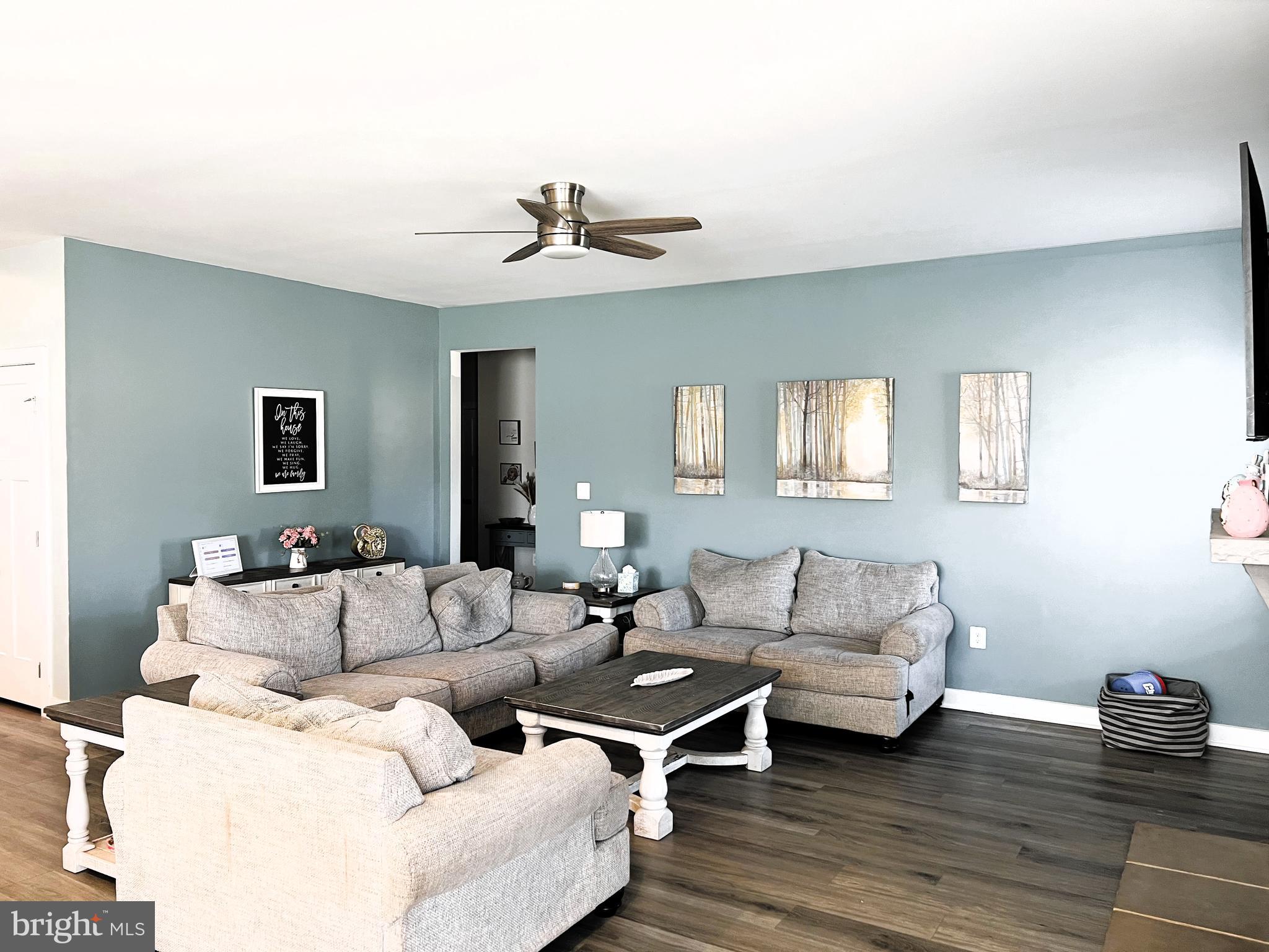14905 Mapleridge Road Culpeper, VA 22701 - Photo 7 of 40 a living room with furniture and a wooden floor