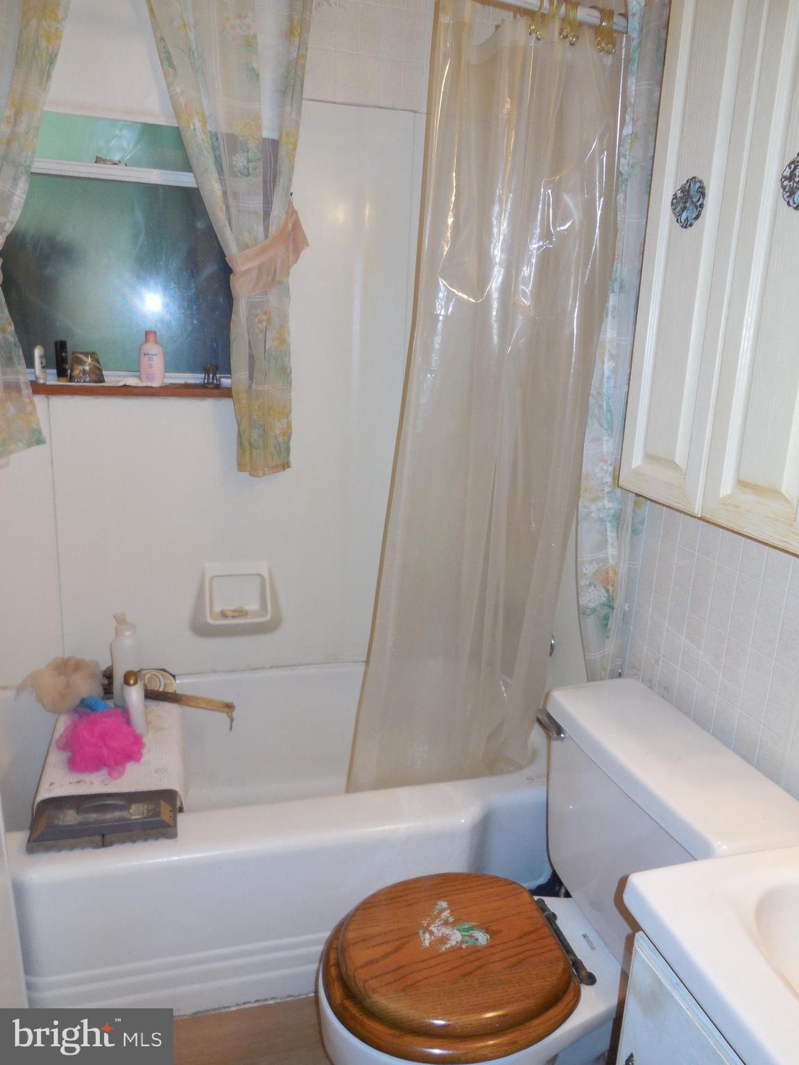 171 Riverside Road Baltimore, MD 21221 - Photo 11 of 21 a bathroom with a toilet and a shower