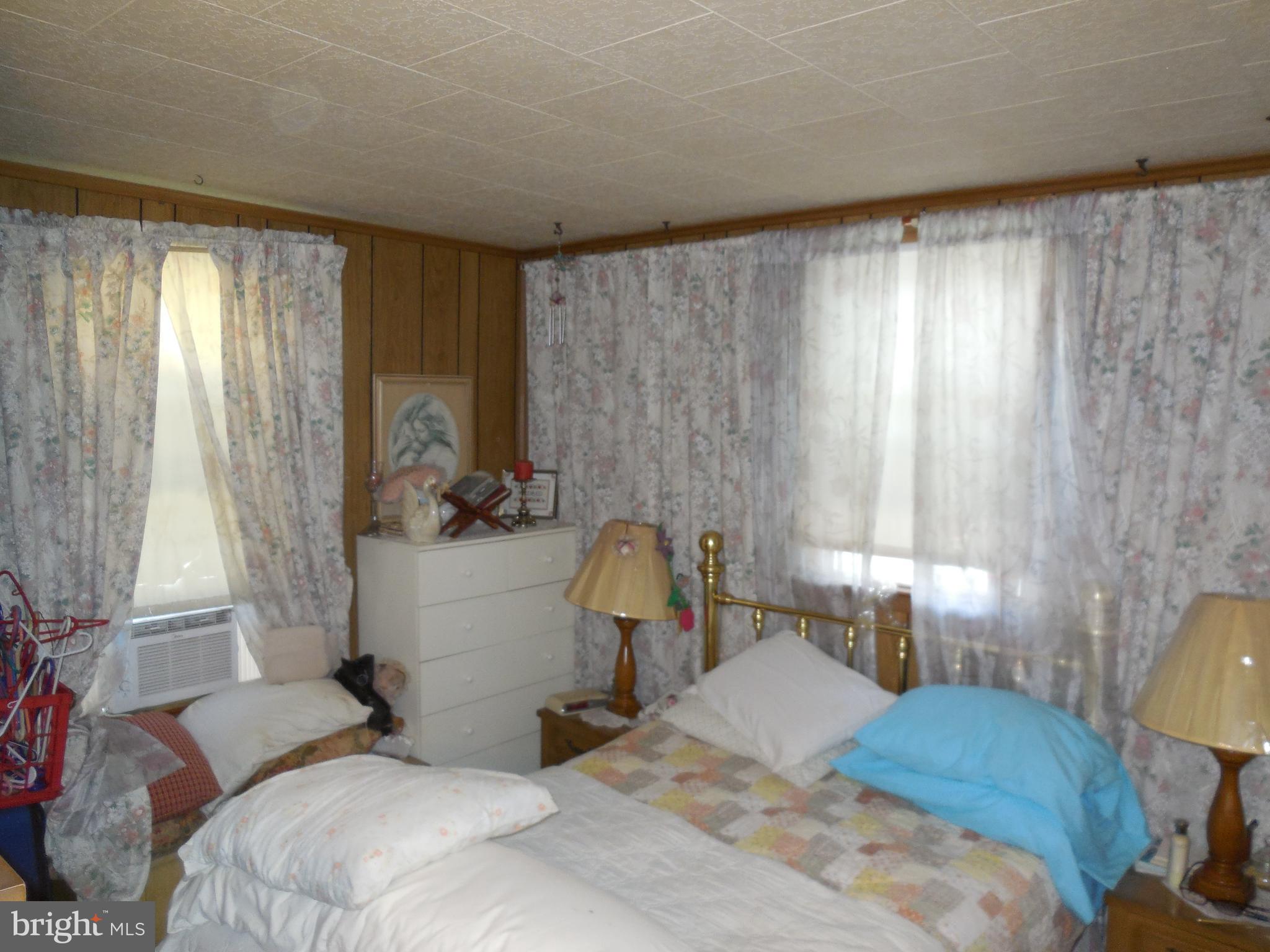 171 Riverside Road Baltimore, MD 21221 - Photo 12 of 21 a bedroom with a bed and a window