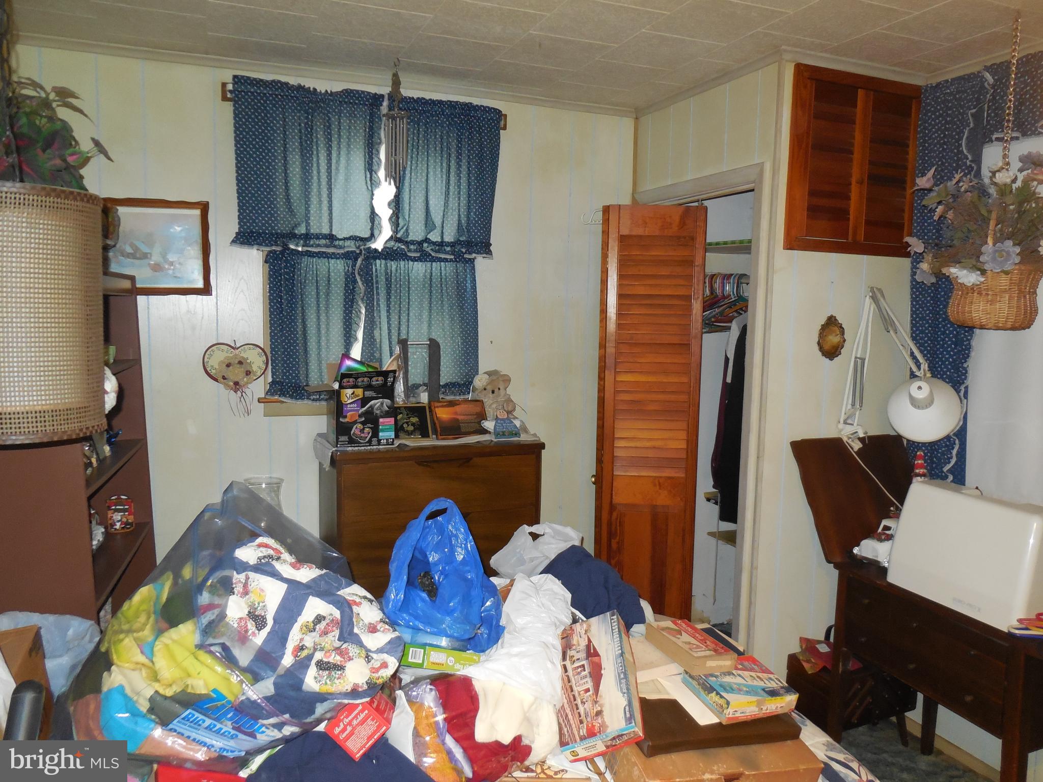 171 Riverside Road Baltimore, MD 21221 - Photo 13 of 21 a bed room with furniture and a window