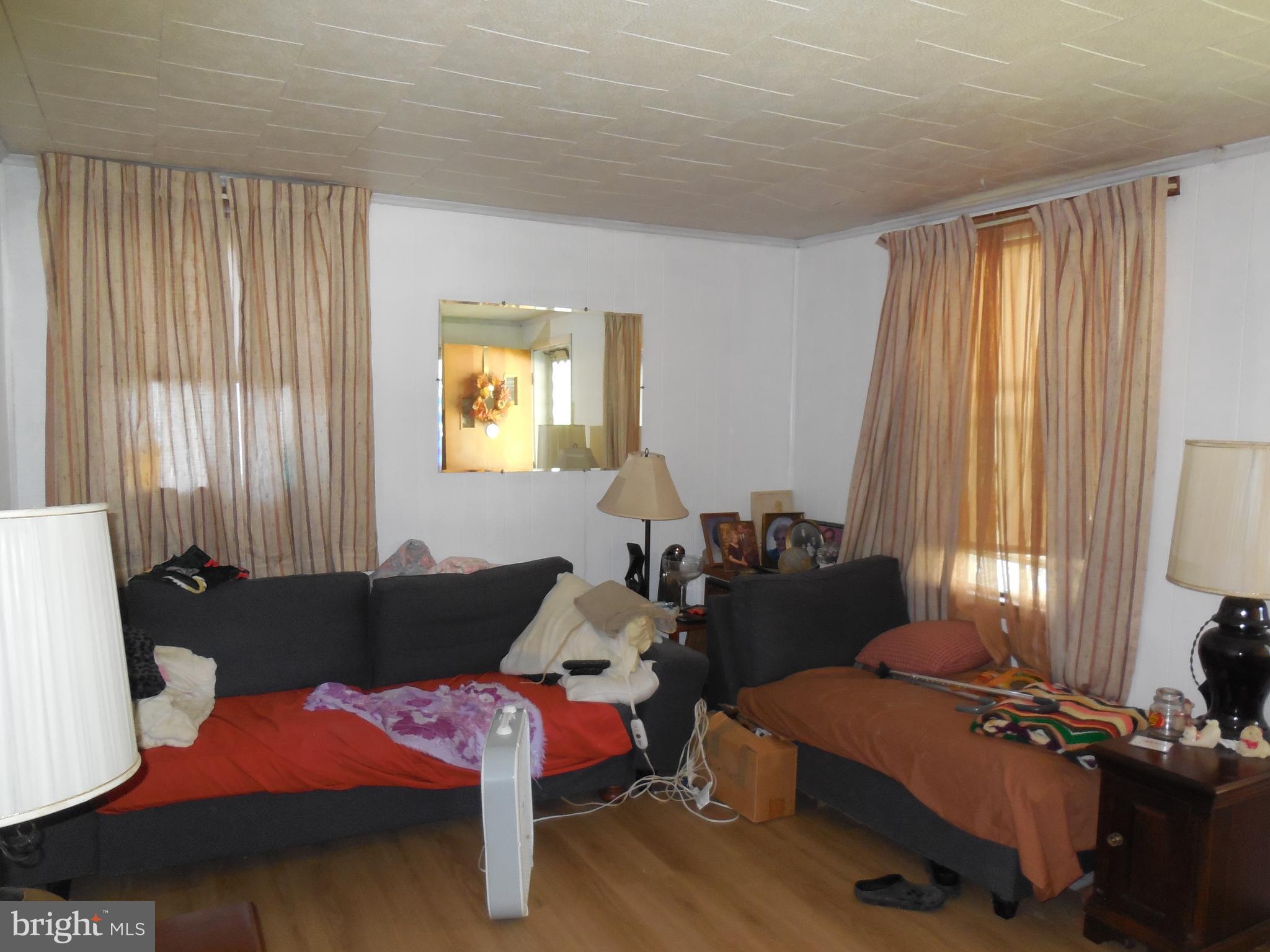 171 Riverside Road Baltimore, MD 21221 - Photo 8 of 21 a bedroom with furniture and a window
