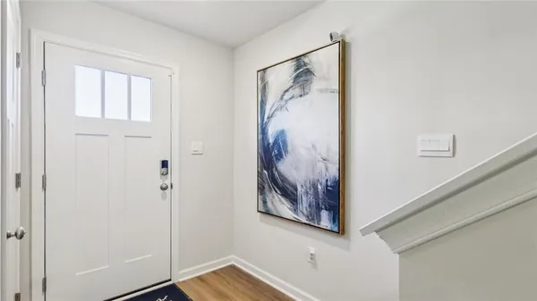 a view of a hallway with a painting on the wall