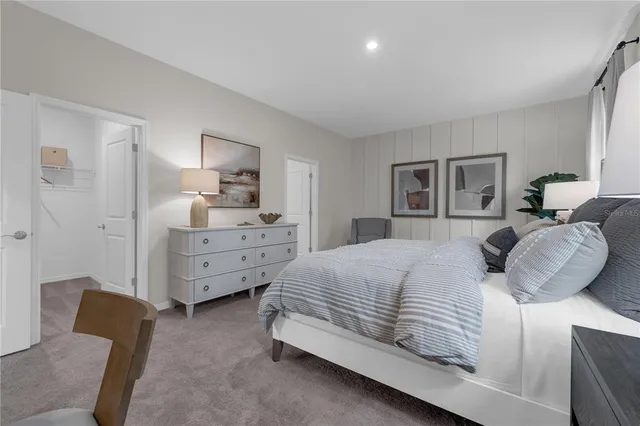 a bedroom with bed and window