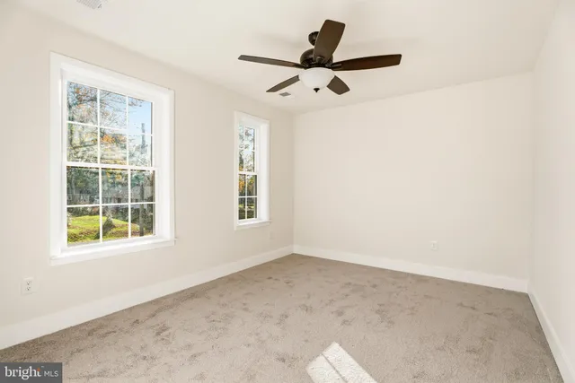 a bathroom with a sink a toilet and vanity