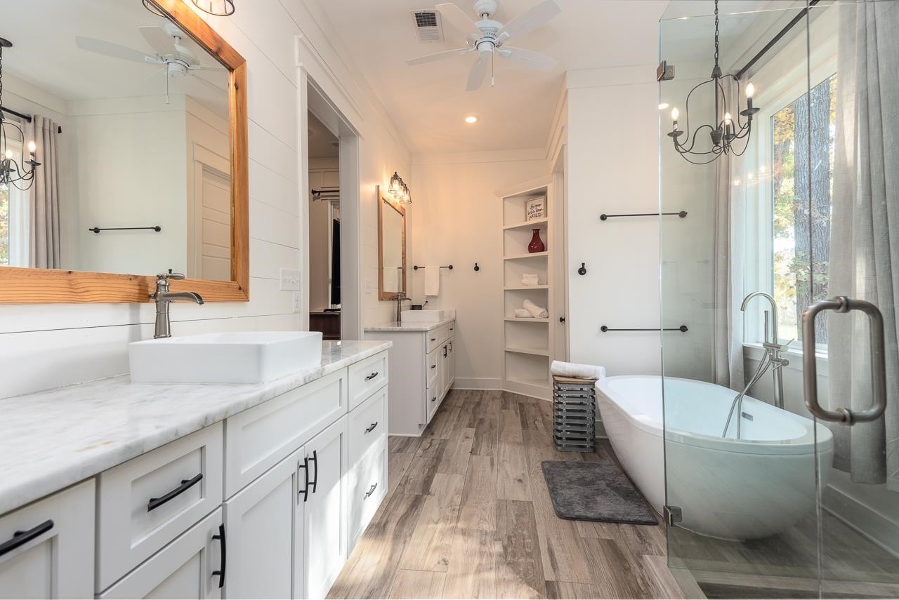 570 Wildwood Road Eads, TN 38028 - Photo 15 of 38 a spacious bathroom with a double vanity sink a mirror and a bathtub