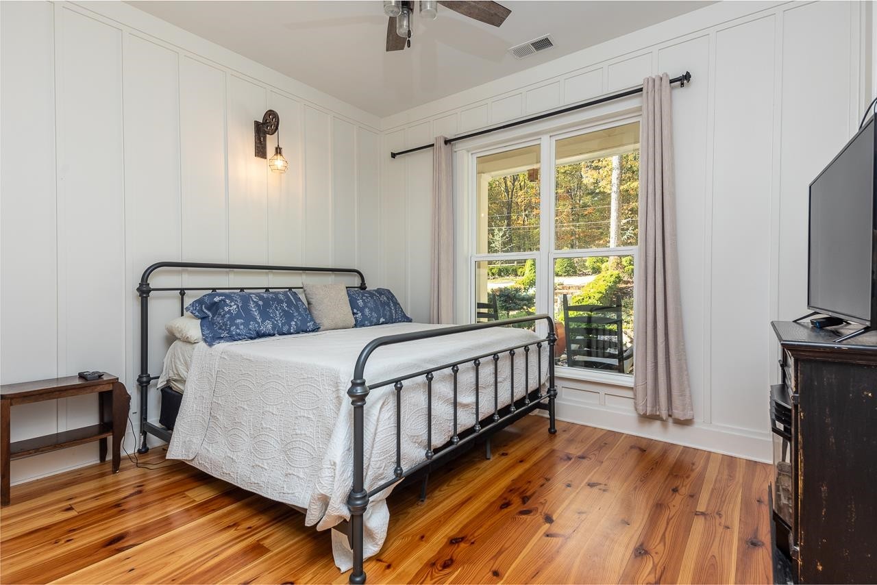 570 Wildwood Road Eads, TN 38028 - Photo 19 of 38 a bedroom with a bed and a tv