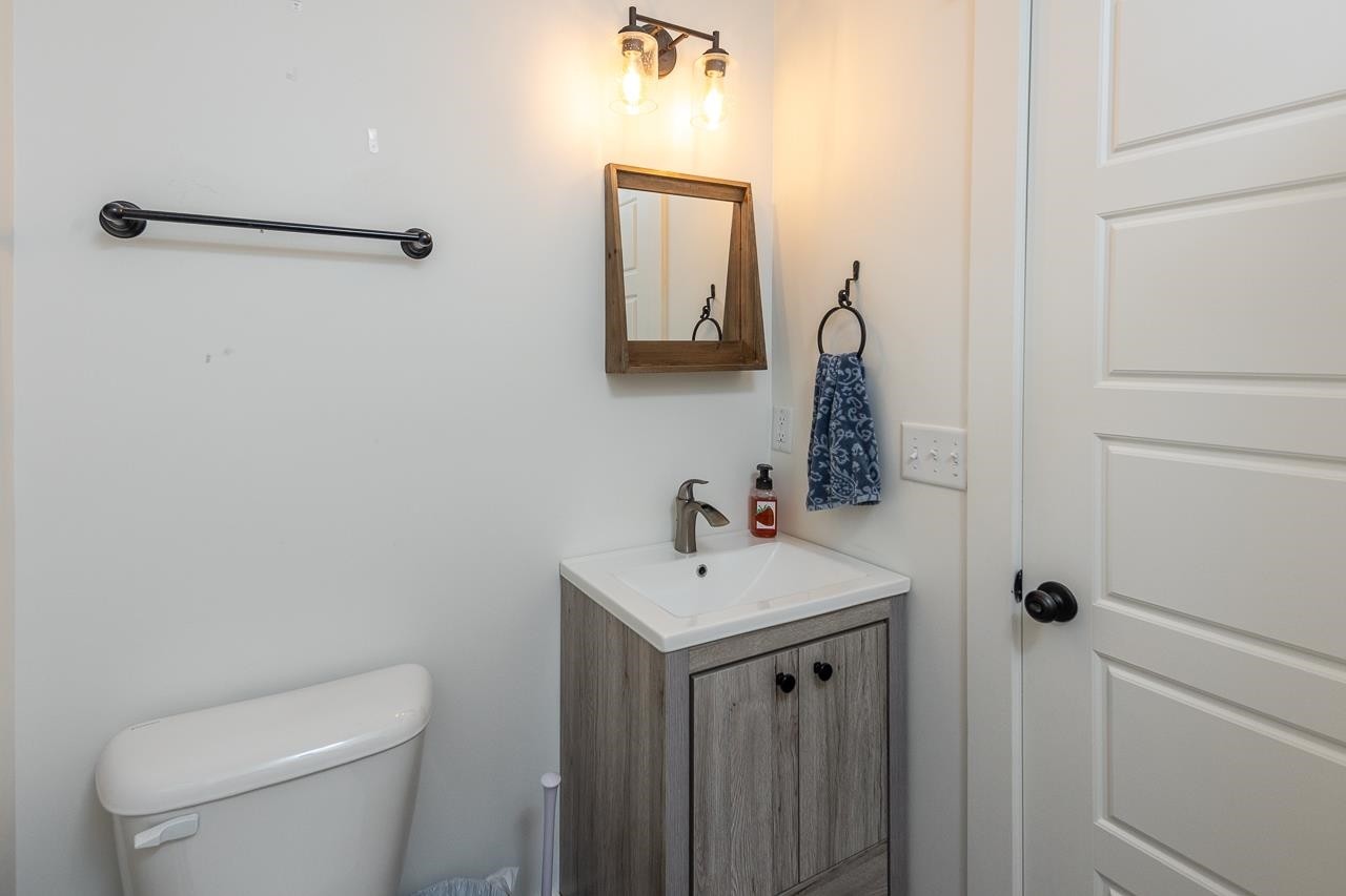 570 Wildwood Road Eads, TN 38028 - Photo 23 of 38 a bathroom with a toilet a sink and mirror