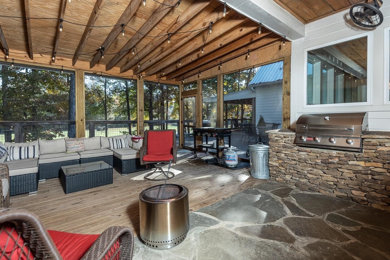 570 Wildwood Road Eads, TN 38028 - Photo 26 of 38 a living room with furniture and a floor to ceiling window