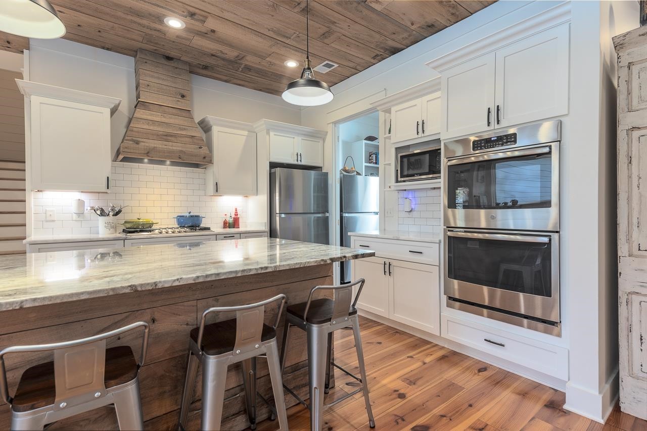 570 Wildwood Road Eads, TN 38028 - Photo 3 of 38 a kitchen with stainless steel appliances a stove a refrigerator and a sink