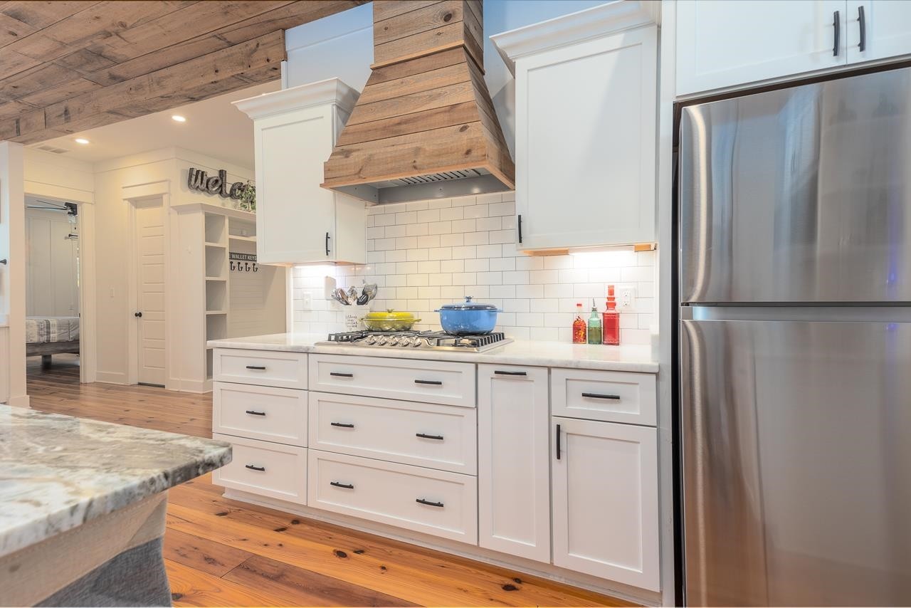 570 Wildwood Road Eads, TN 38028 - Photo 4 of 38 a kitchen with cabinets appliances and a counter space