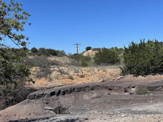 a view of a road with a mountain in the background
