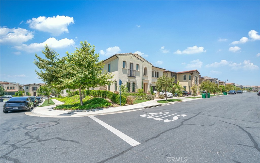 52 Eider Run Irvine, CA 92618 - Photo 4 of 46 a view of a street with a building in the background