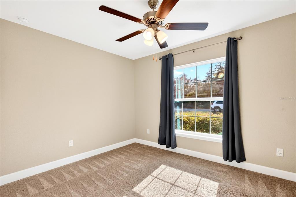 501 Marion Oaks Golf Road Ocala, FL 34473 - Photo 17 of 33 a view of an empty room with a window