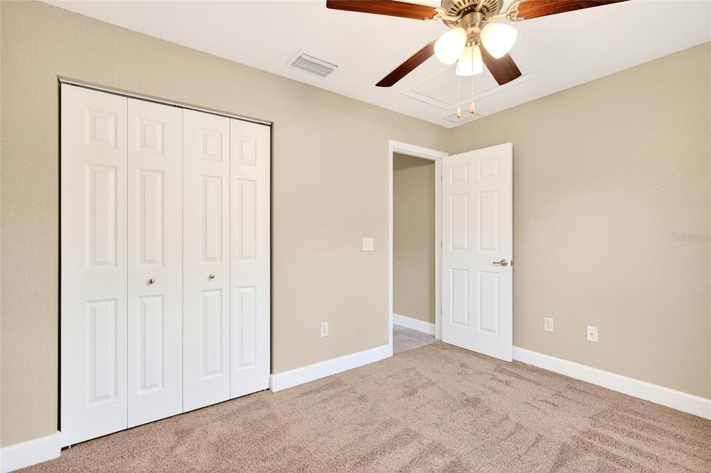 501 Marion Oaks Golf Road Ocala, FL 34473 - Photo 18 of 33 an empty room with chandelier fan