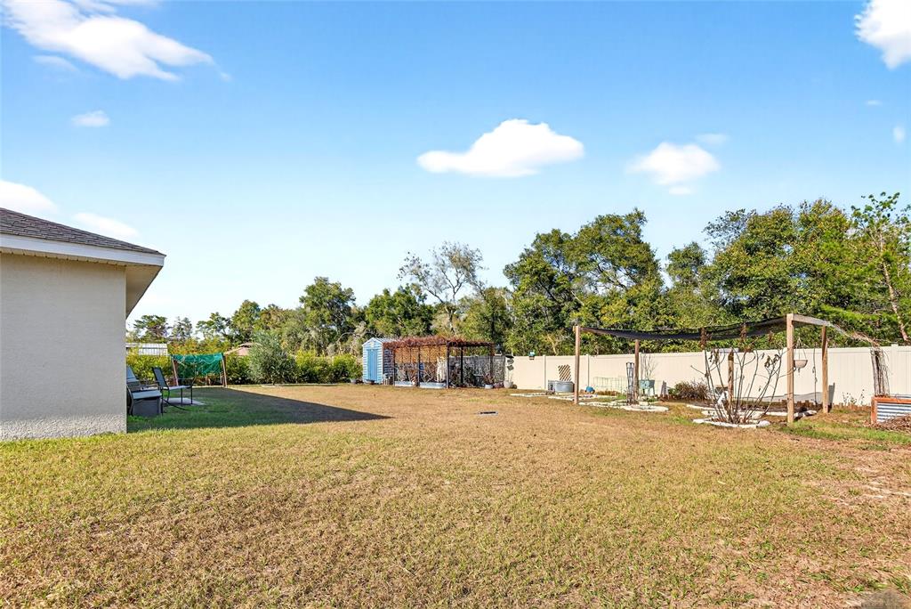 501 Marion Oaks Golf Road Ocala, FL 34473 - Photo 28 of 33 a view of a house with a yard