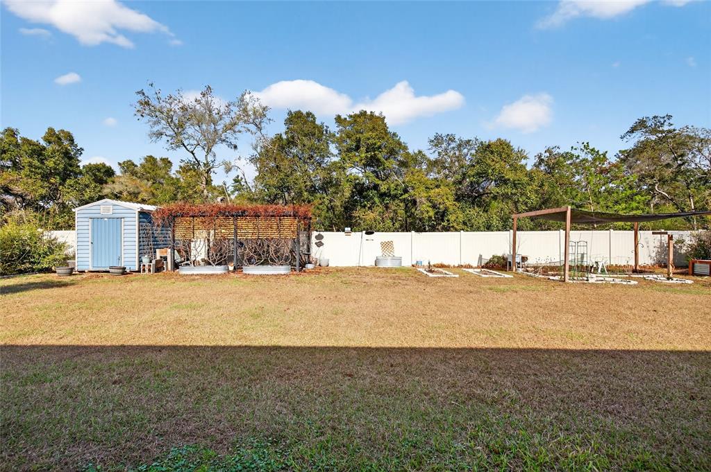 501 Marion Oaks Golf Road Ocala, FL 34473 - Photo 31 of 33 a view of a field with a big yard
