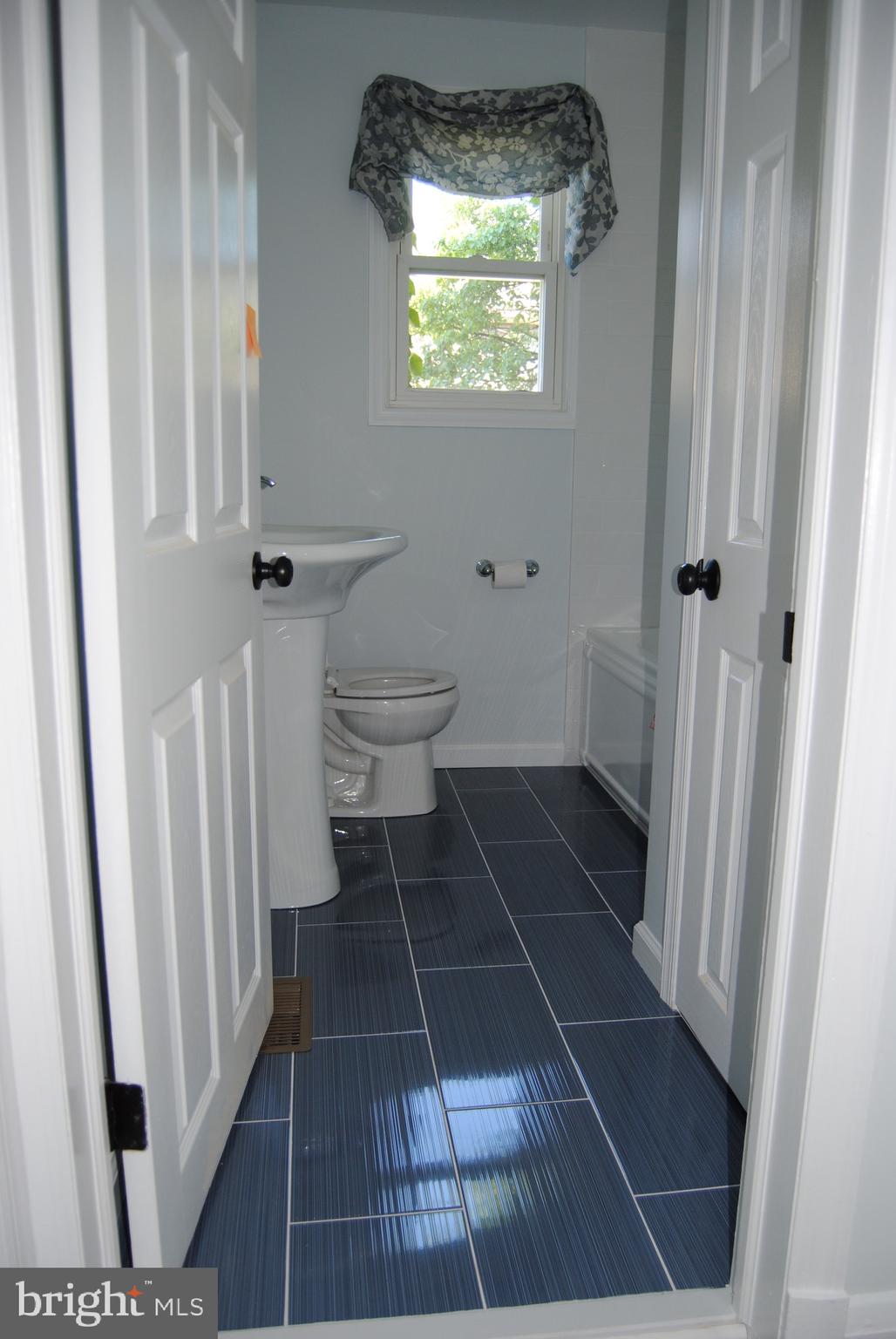 1252 Sulphur Spring Road Baltimore, MD 21227 - Photo 22 of 51 Beautiful, classic tile... 1st floor full bath