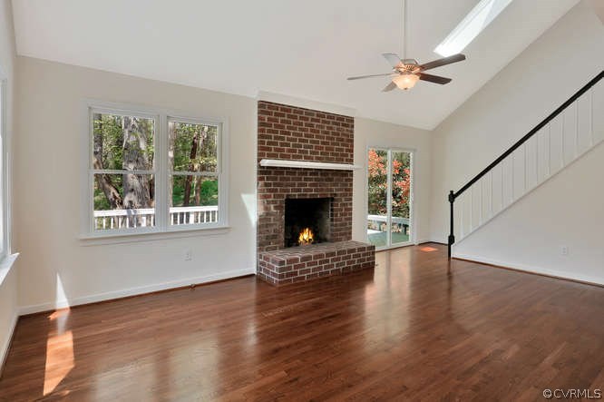5700 North Chase Road Midlothian, VA 23112 - Photo 8 of 30 a view of an empty room with wooden floor fireplace and a window