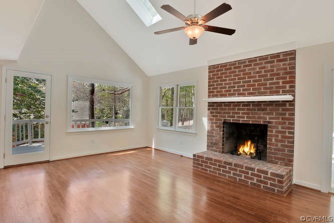 5700 North Chase Road Midlothian, VA 23112 - Photo 9 of 30 a living room with furniture and a fireplace