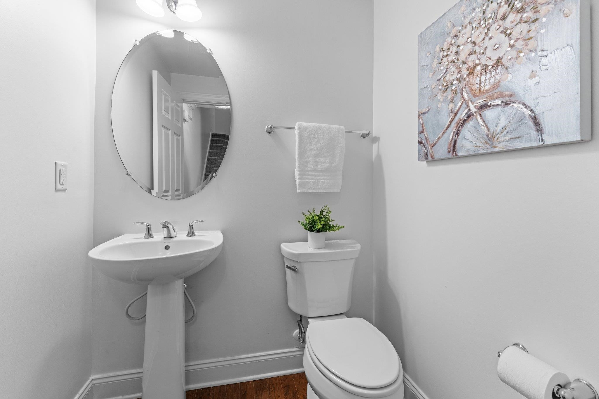 10321 Sablewood Drive, Unit 109 Raleigh, NC 27617 - Photo 17 of 47 a bathroom with a toilet sink and mirror