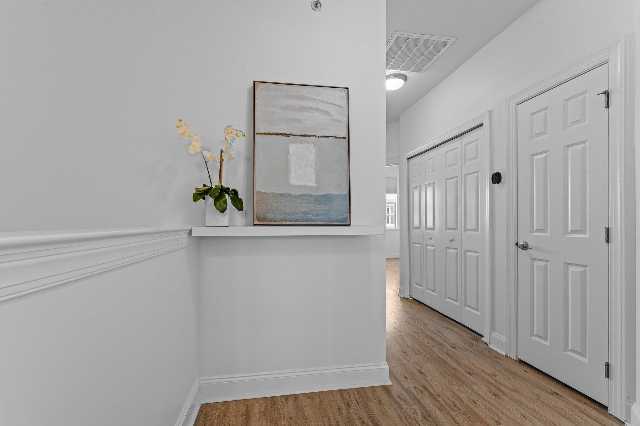 10321 Sablewood Drive, Unit 109 Raleigh, NC 27617 - Photo 18 of 47 a view of an entryway with wooden floor