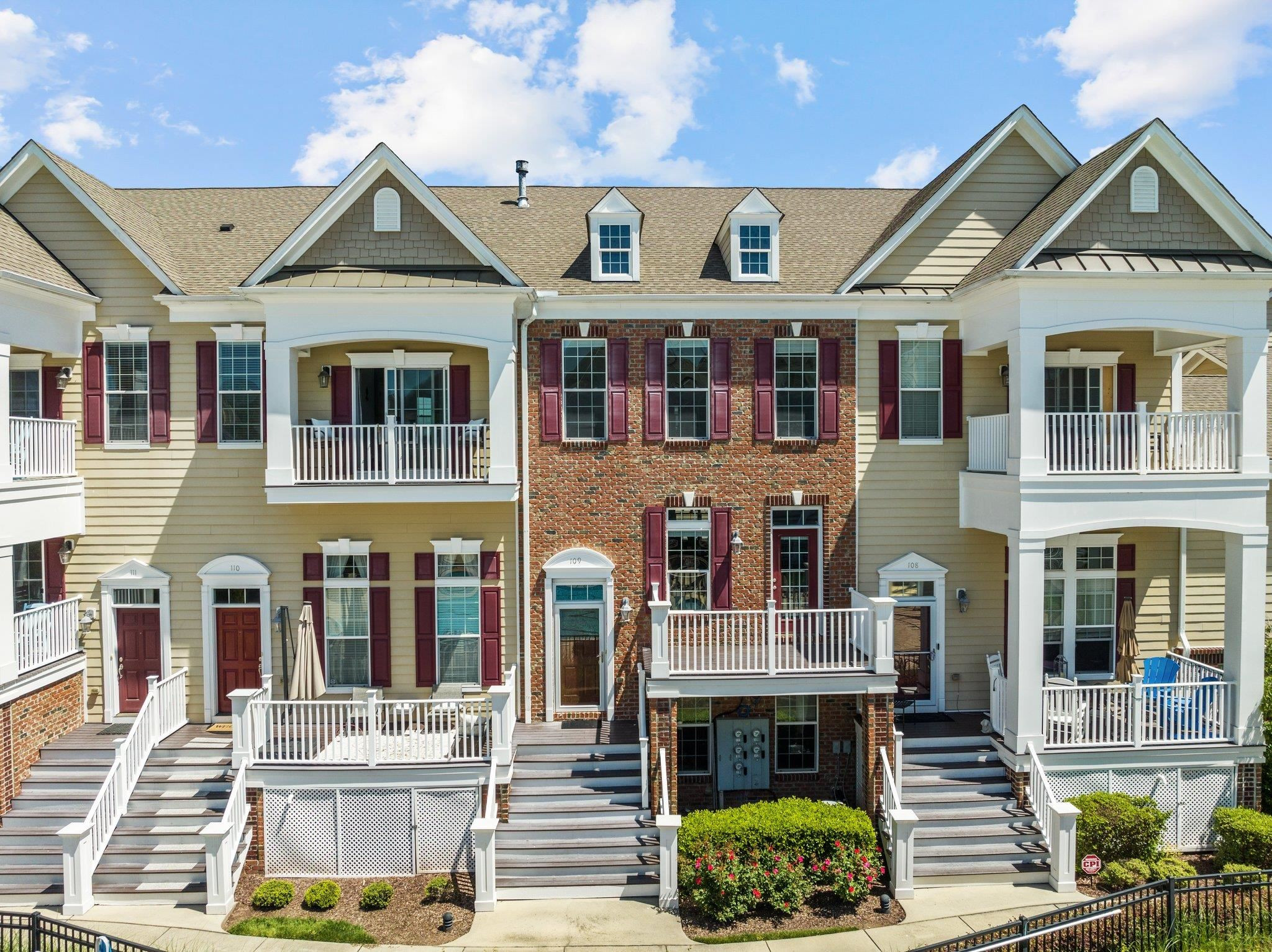 10321 Sablewood Drive, Unit 109 Raleigh, NC 27617 - Photo 2 of 47 a front view of a house with a yard