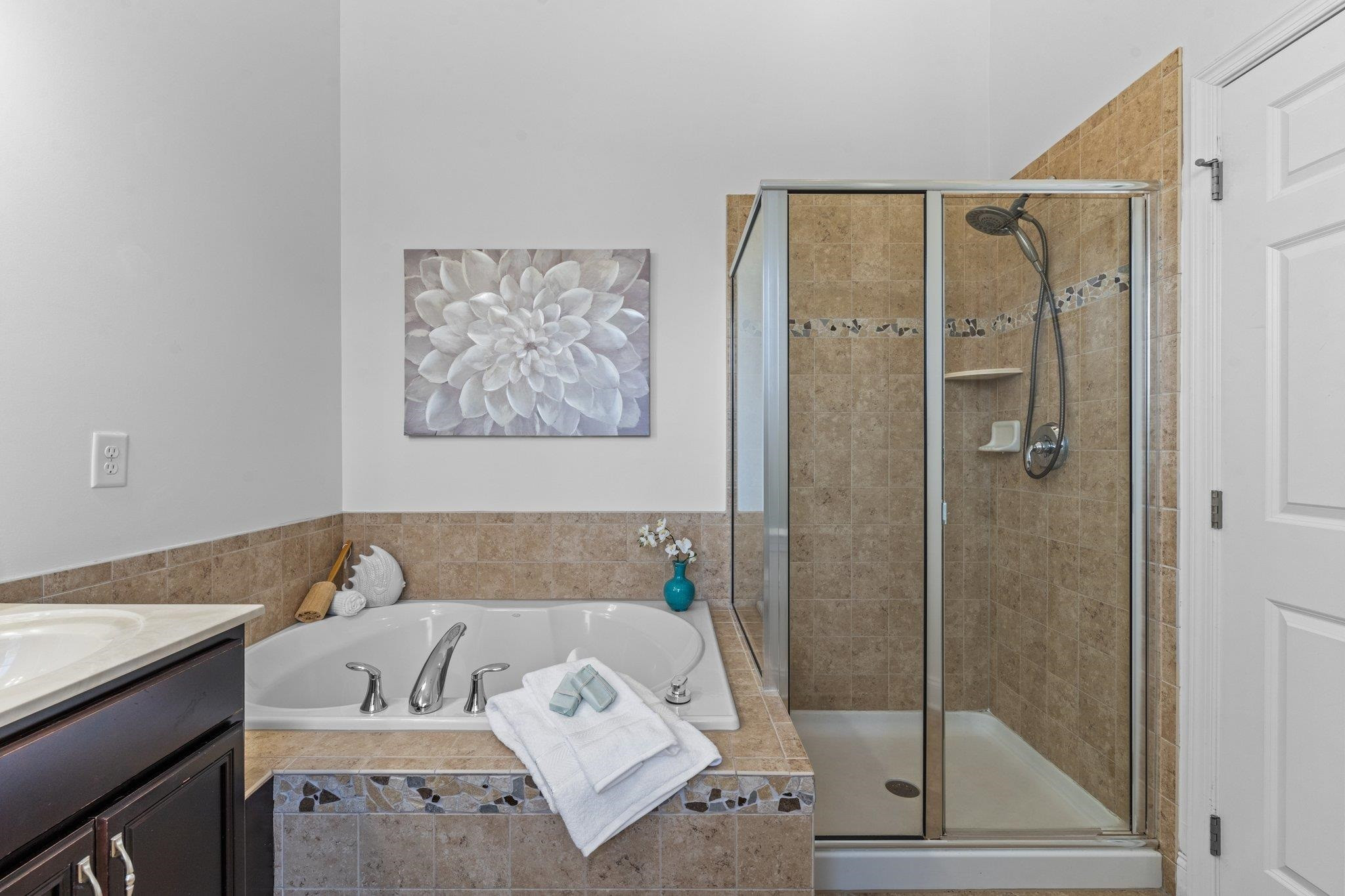 10321 Sablewood Drive, Unit 109 Raleigh, NC 27617 - Photo 22 of 47 a bath room with a bath tub and a shower