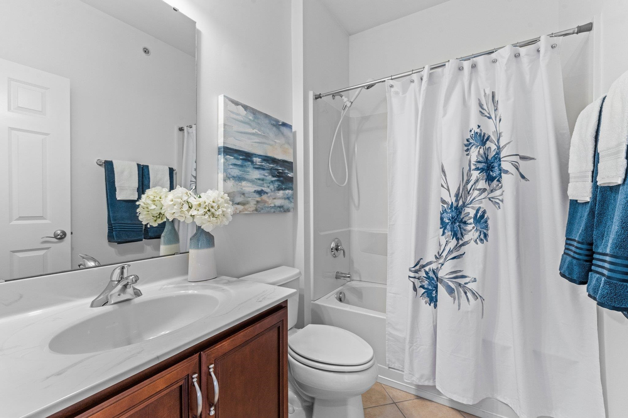 10321 Sablewood Drive, Unit 109 Raleigh, NC 27617 - Photo 25 of 47 a bathroom with a granite countertop sink toilet and shower