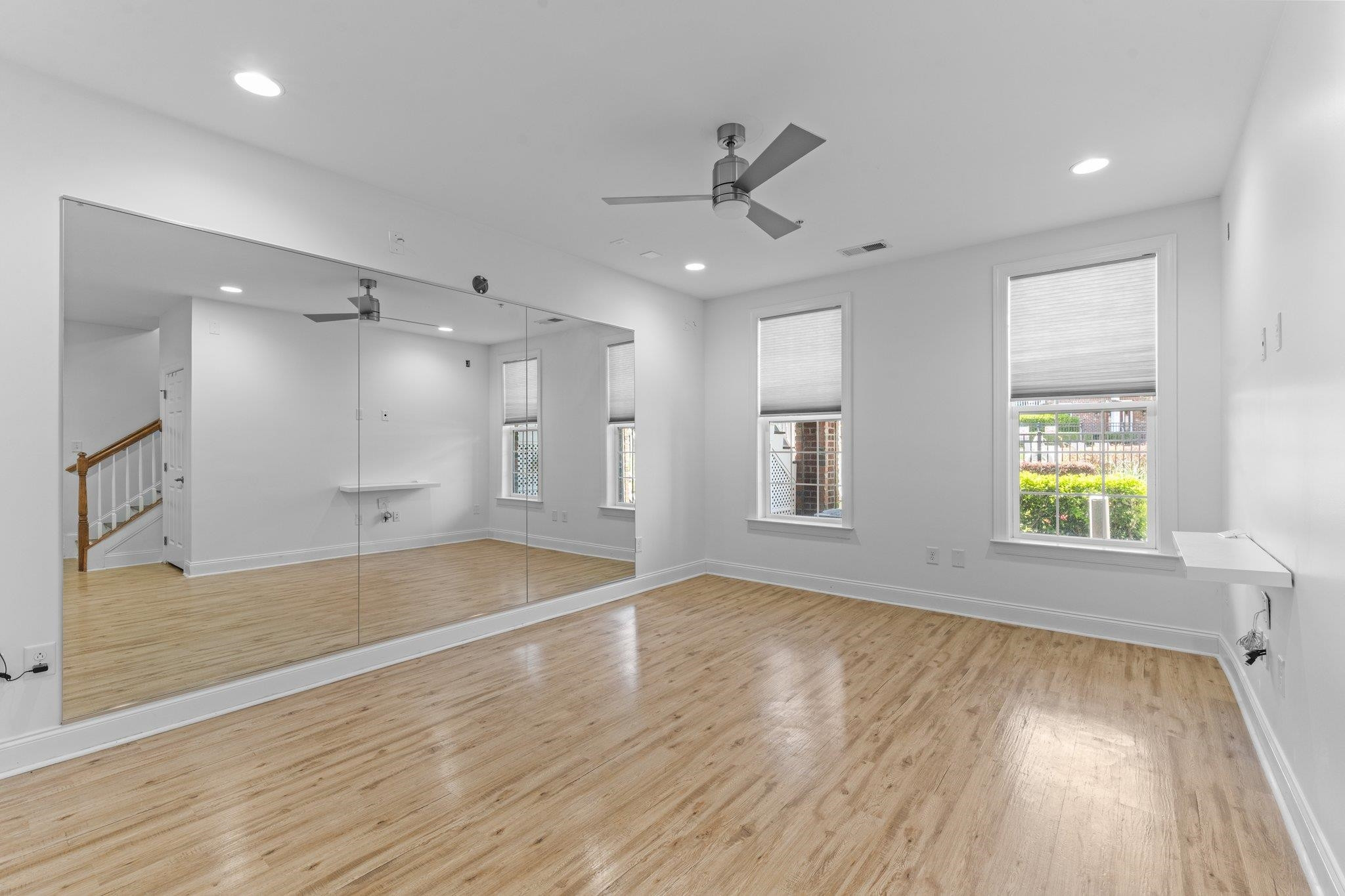 10321 Sablewood Drive, Unit 109 Raleigh, NC 27617 - Photo 31 of 47 a view of an empty room with wooden floor and a window