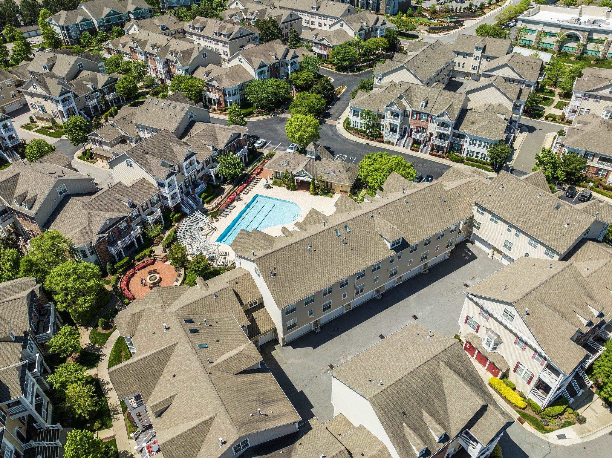 10321 Sablewood Drive, Unit 109 Raleigh, NC 27617 - Photo 42 of 47 an aerial view of a house with a swimming pool and outdoor seating