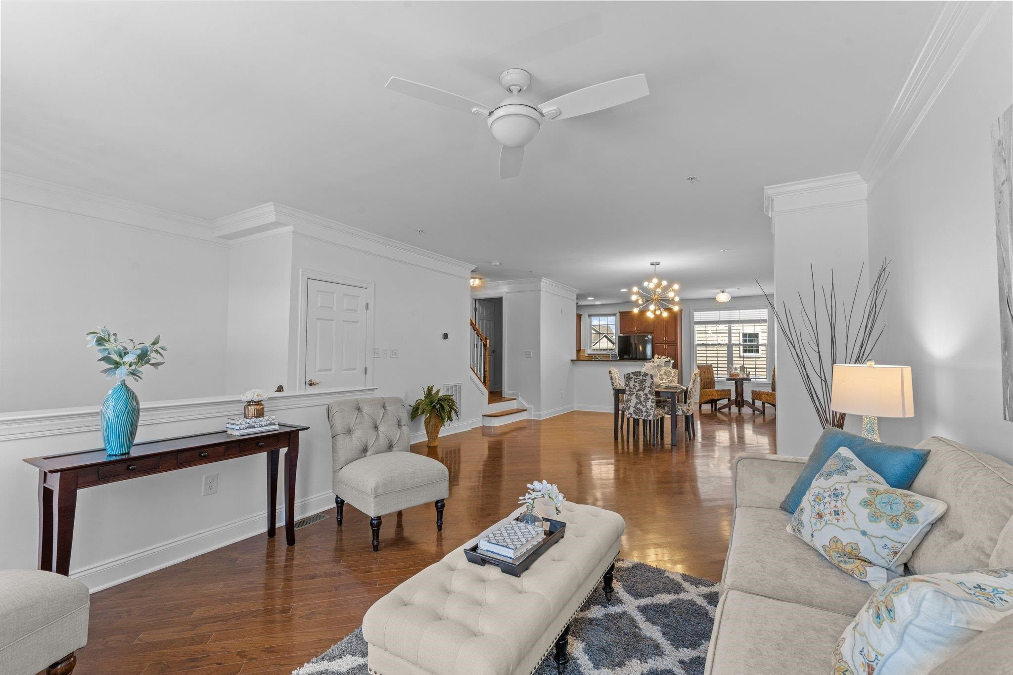 10321 Sablewood Drive, Unit 109 Raleigh, NC 27617 - Photo 6 of 47 a living room with furniture and wooden floor