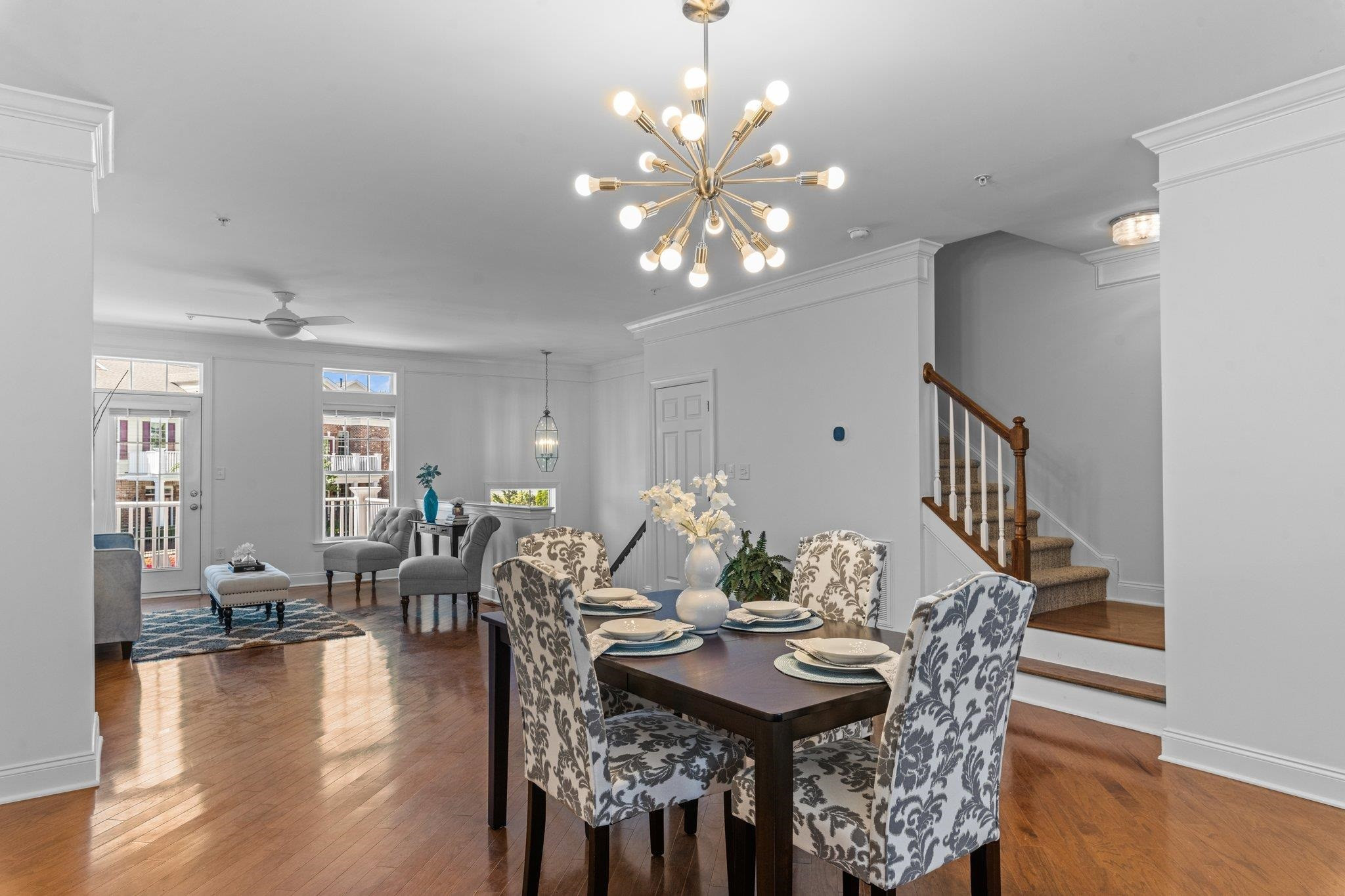 10321 Sablewood Drive, Unit 109 Raleigh, NC 27617 - Photo 8 of 47 a view of a dining room with furniture and wooden floor