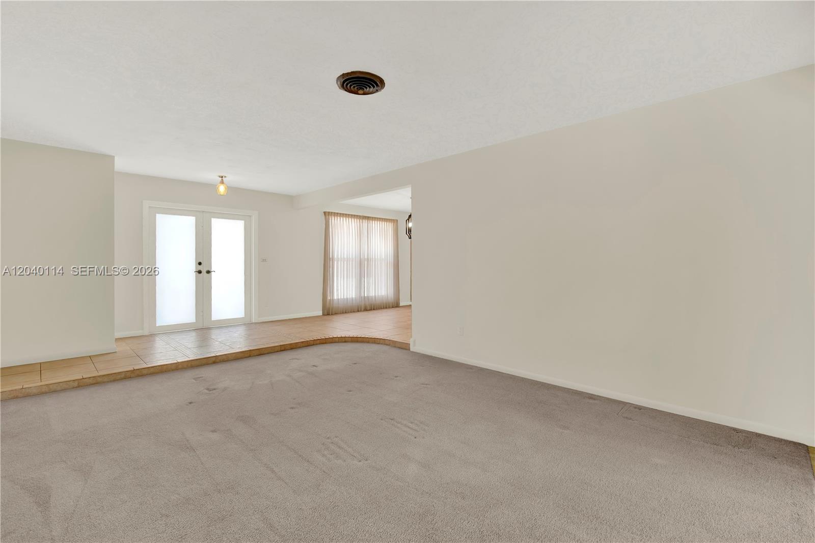 10435 Southwest 96th Street Miami, FL 33176 - Photo 8 of 44 View from the living room to the foyer with lots of natural lighting