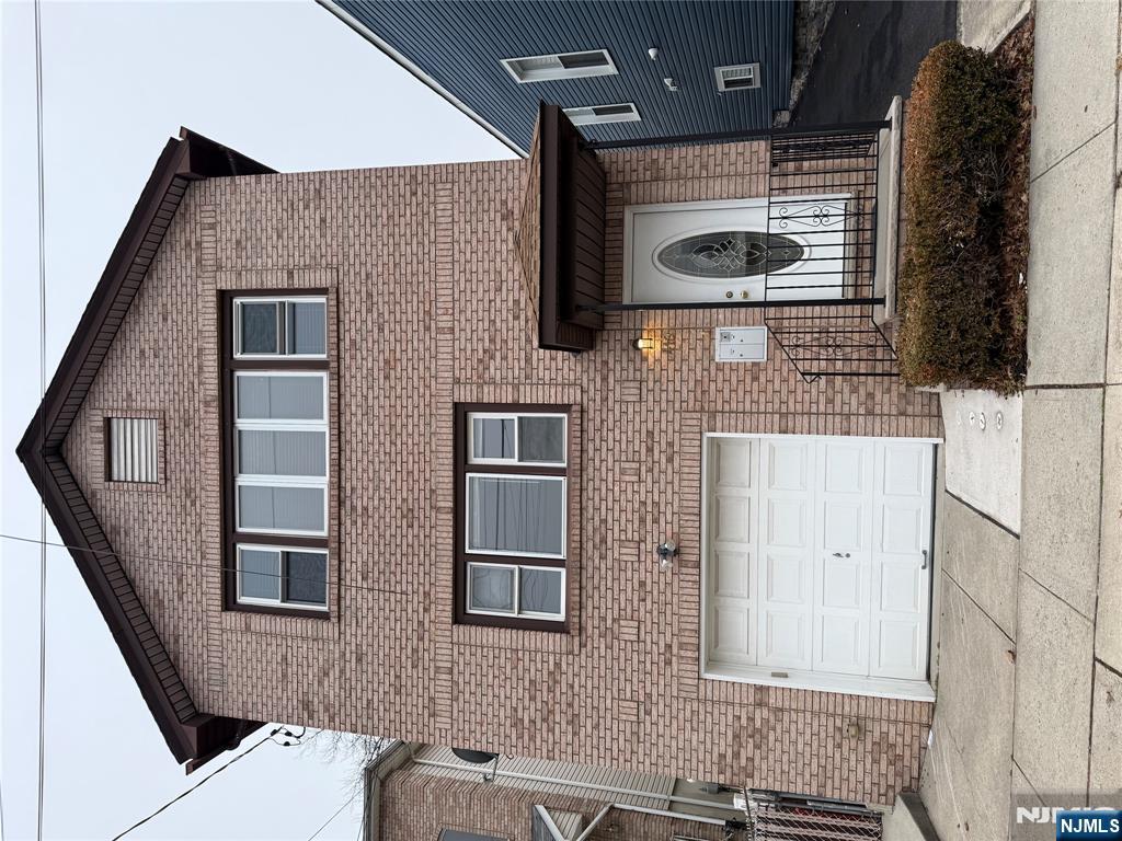 a front view of a house with a garage