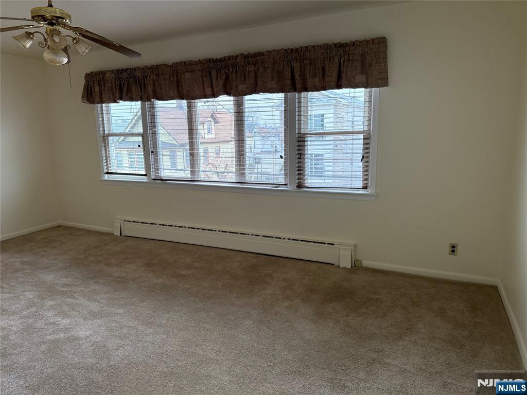 419 Elm Street, Unit 2 Kearny, NJ 07032 - Photo 2 of 8 an empty room with a window