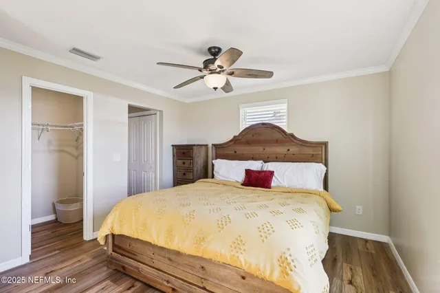 a bedroom with a bed and a table