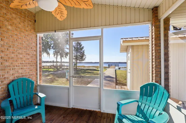 a view of a chair and table in the balcony
