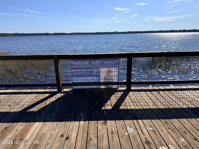 a view of barbeque grill and wooden floor