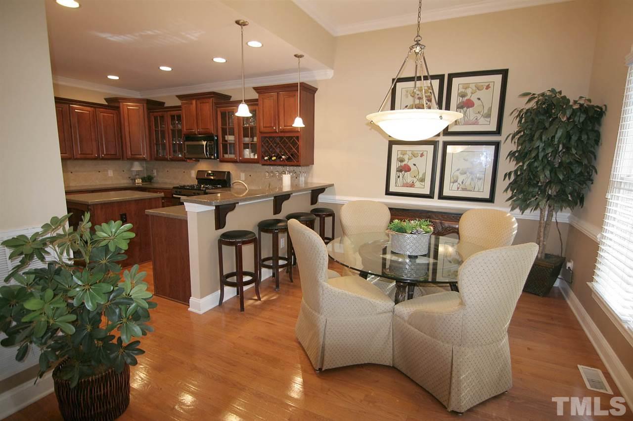 7334 Fontana Ridge Lane Raleigh, NC 27613 - Photo 11 of 24 a living room with furniture kitchen view and a potted plant